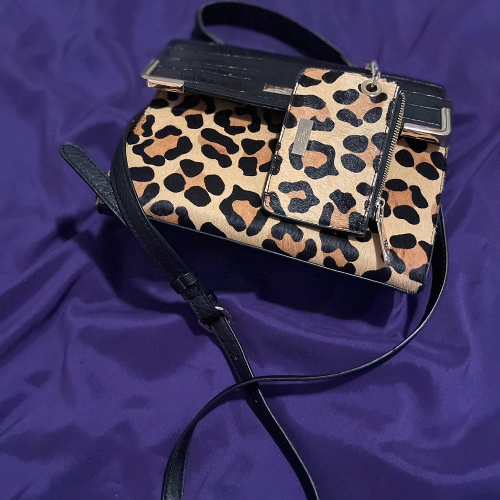 Leopard color cross body bag can be worn as a hand bag or cross body